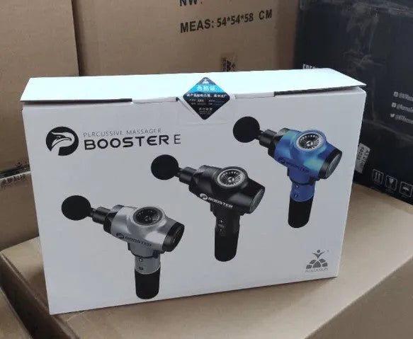 Black and white handheld percussion muscle massage gun with four interchangeable foam heads on a grey background.