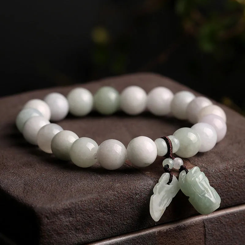 Natural emerald hanging bracelet jade in geometric shapes with apple, Maitreya Buddha, or double money bag charms, a unisex jewellery piece for women made from carved jade stones