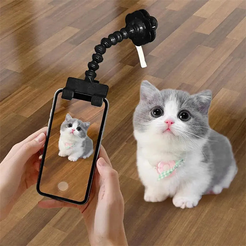 Black pet photography tool with rotating clip and phone holder for attracting pet attention during photos