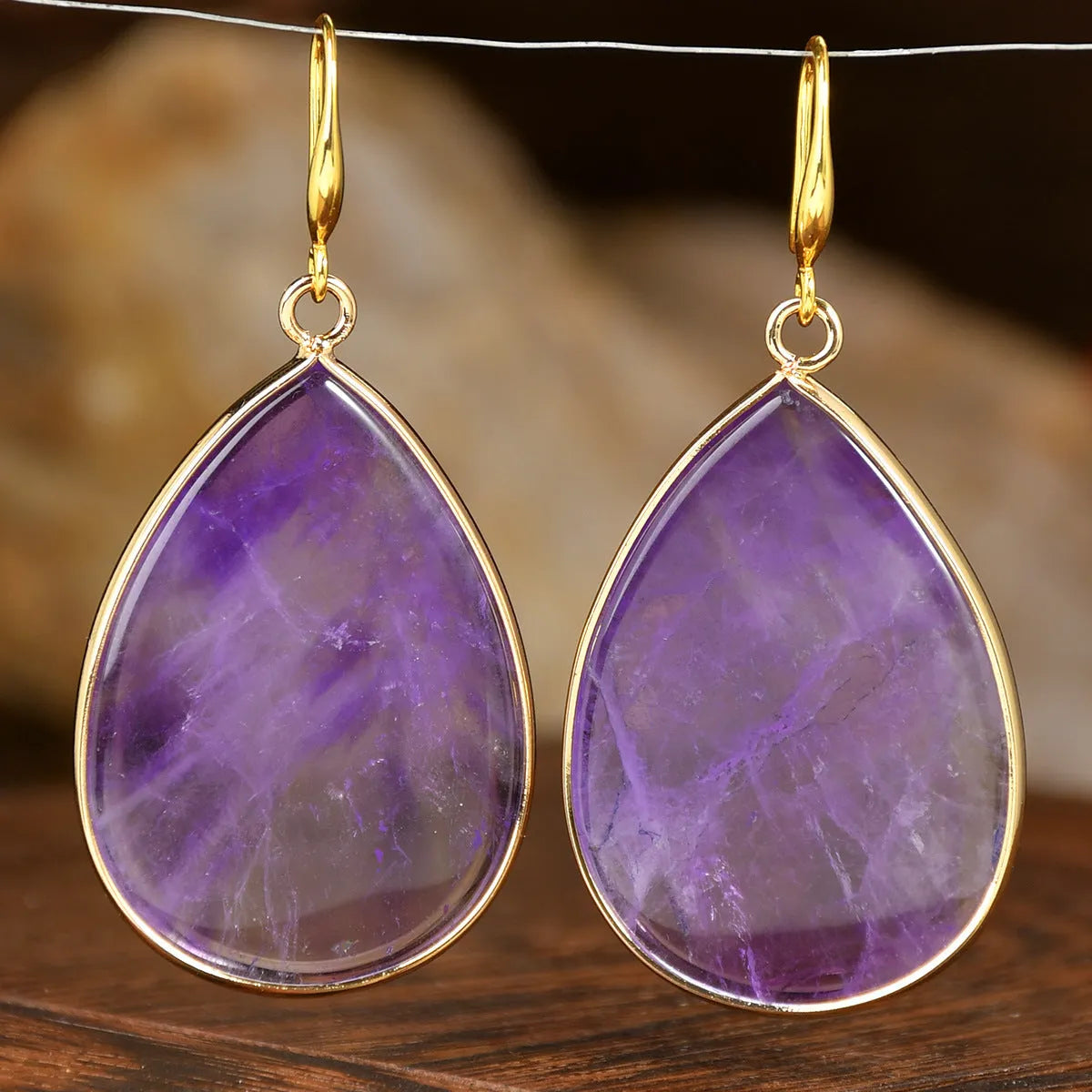 Women's retro-style drop earrings with a natural stone pendant in a water drop shape on an electroplated setting.