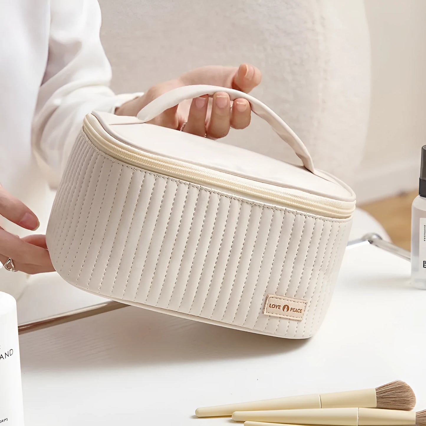 Open-top pastel pink PU leather makeup bag with a flat base, showing interior space.
