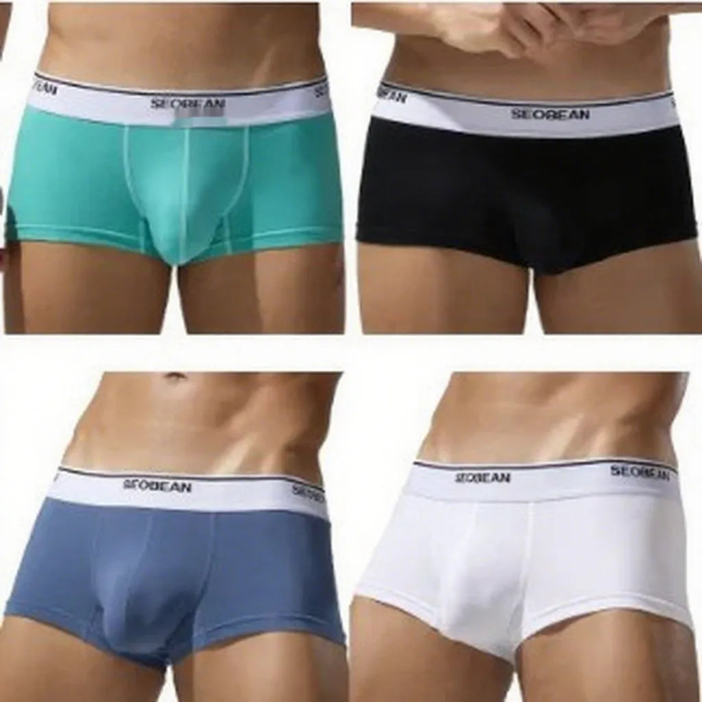 Men's solid colour cotton low waist boxers in sizes M to XXL.