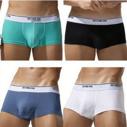 Men's solid colour cotton low waist boxers in sizes M to XXL.