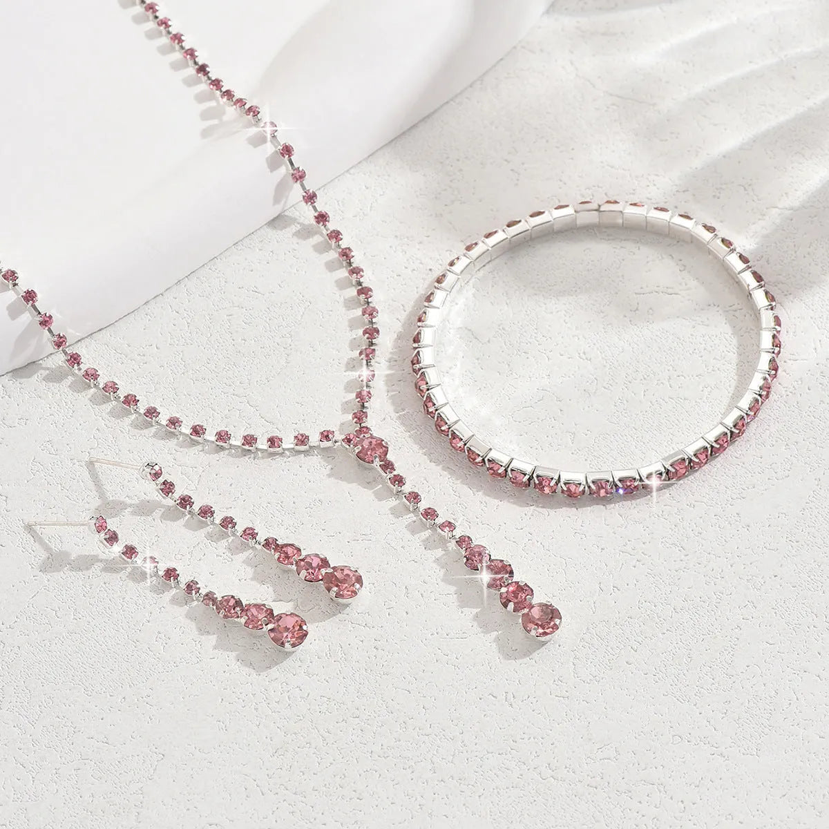Rhinestone heart pendant jewellery set with necklace, bracelet and earrings in silver pink colour