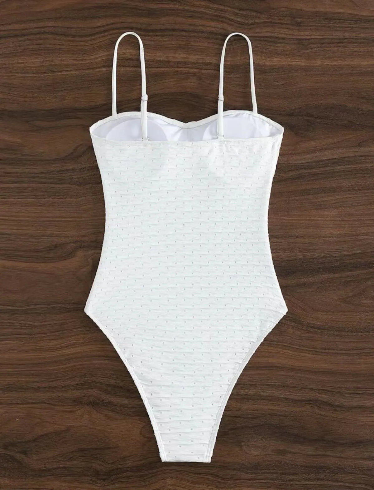 White one-piece swimsuit for women with sling design made from quick-drying polyester fabric