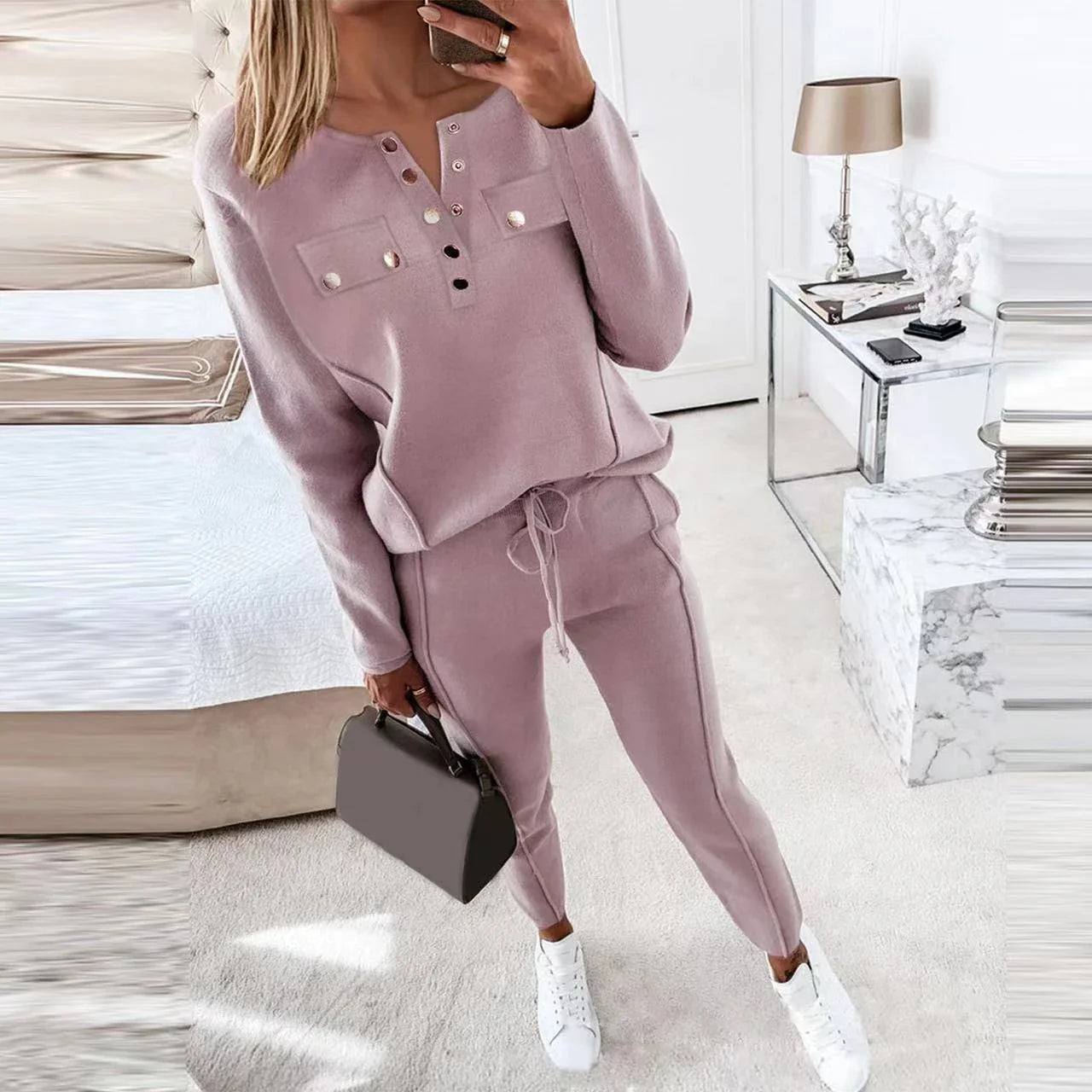 Cozy two-piece loungewear set for women in solid colors, featuring a crewneck top and drawstring-waist pants