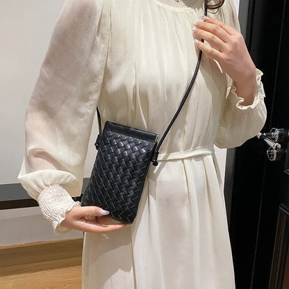 Vintage weave crossbody phone bag in pu leather showing vertical square design and dark cell interior