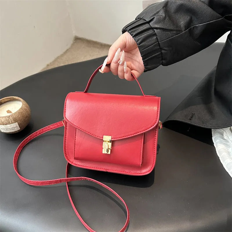 A horizontal square-shaped PU leather shoulder messenger bag in a choice of colours, showing the document compartment interior.