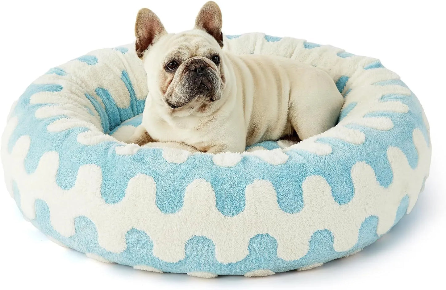 Round blue and white plaid dog bed with plastic sides on wooden floor