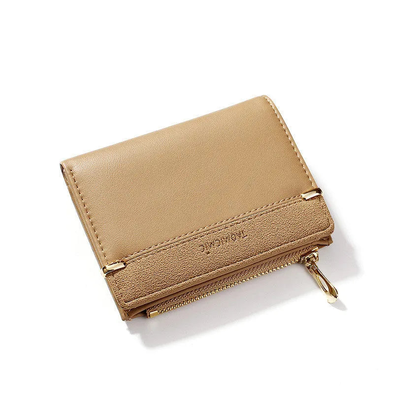 Multi card slot short zipper ladies wallet in 2-fold design with PU leather exterior showing internal compartments