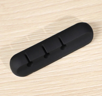 Black silicone USB cable winder for desktop cable management