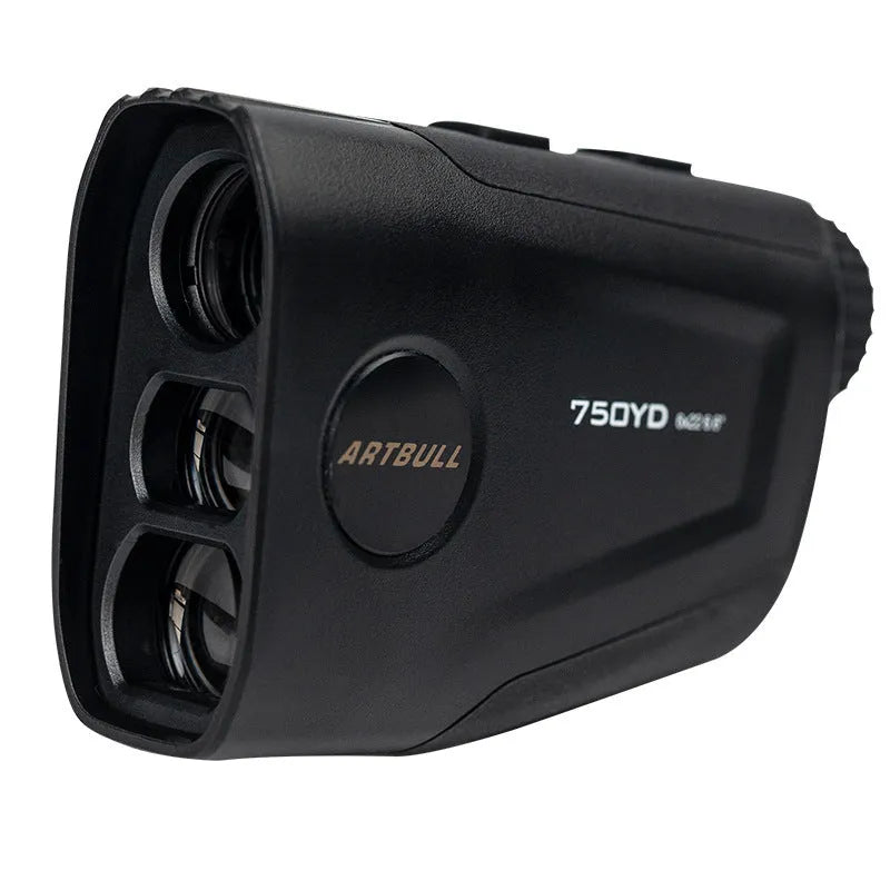 Black golf laser rangefinder with LCD display showing yardage, placed on a green golf towel.