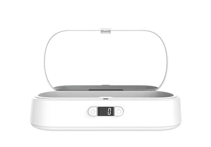 White wireless UV steriliser and charging box for mobile phones and small personal items.
