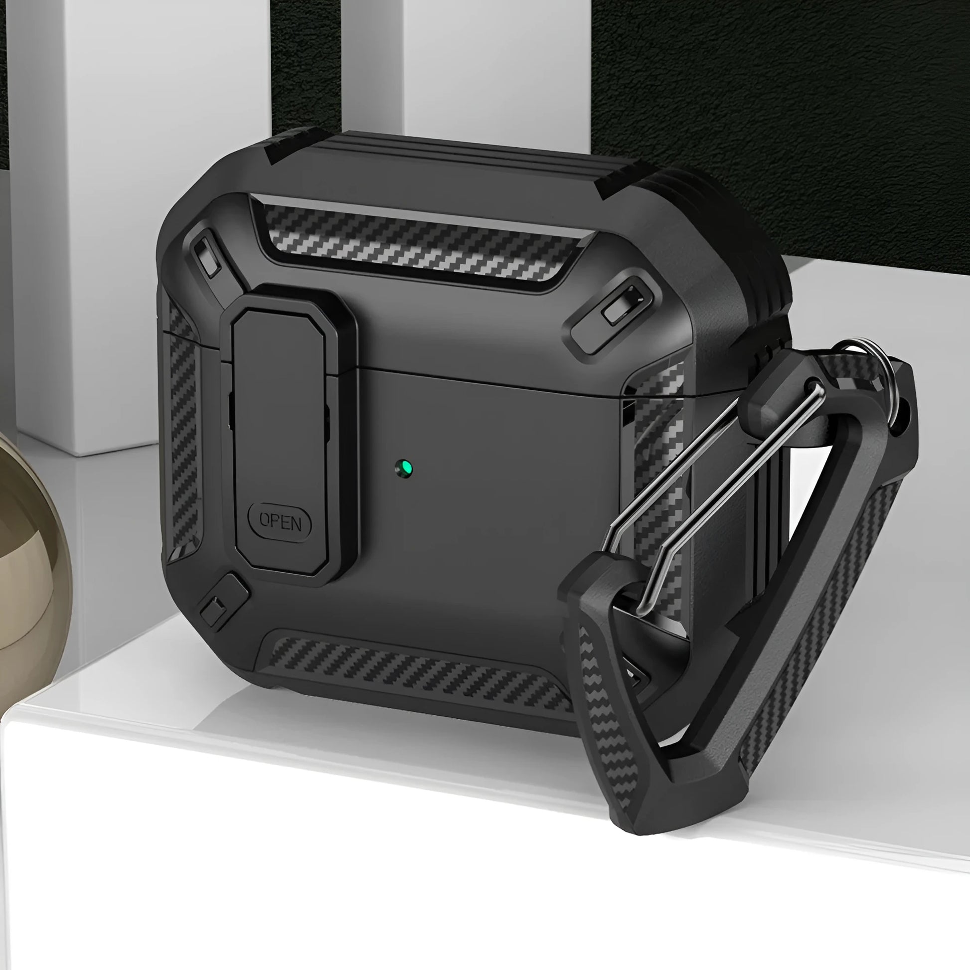 Hard plastic clamshell case for AirPods with a carabiner hook attached, shown in a black and yellow two-tone colour.
