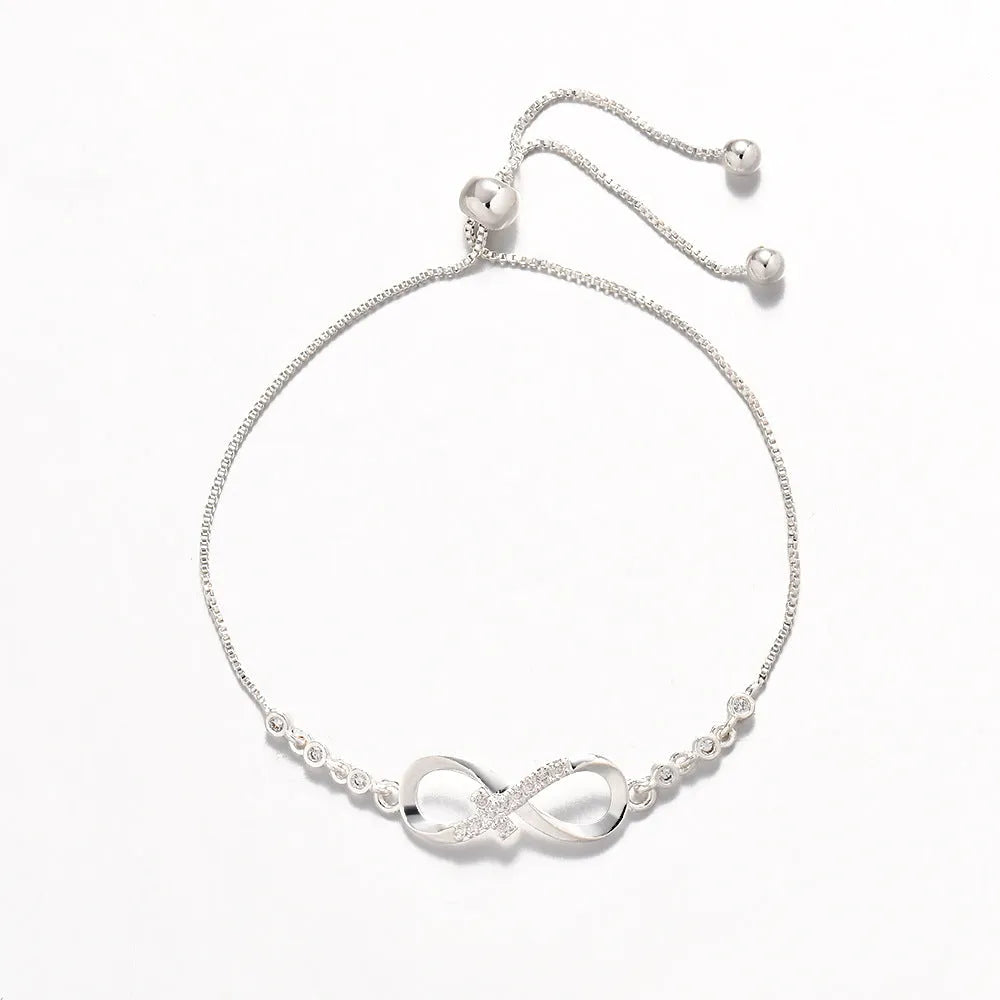 Diamond studded pull-out bracelet with infinite 8-shaped design, copper plastic, 26cm circumference, 20.0mm x 8.0mm