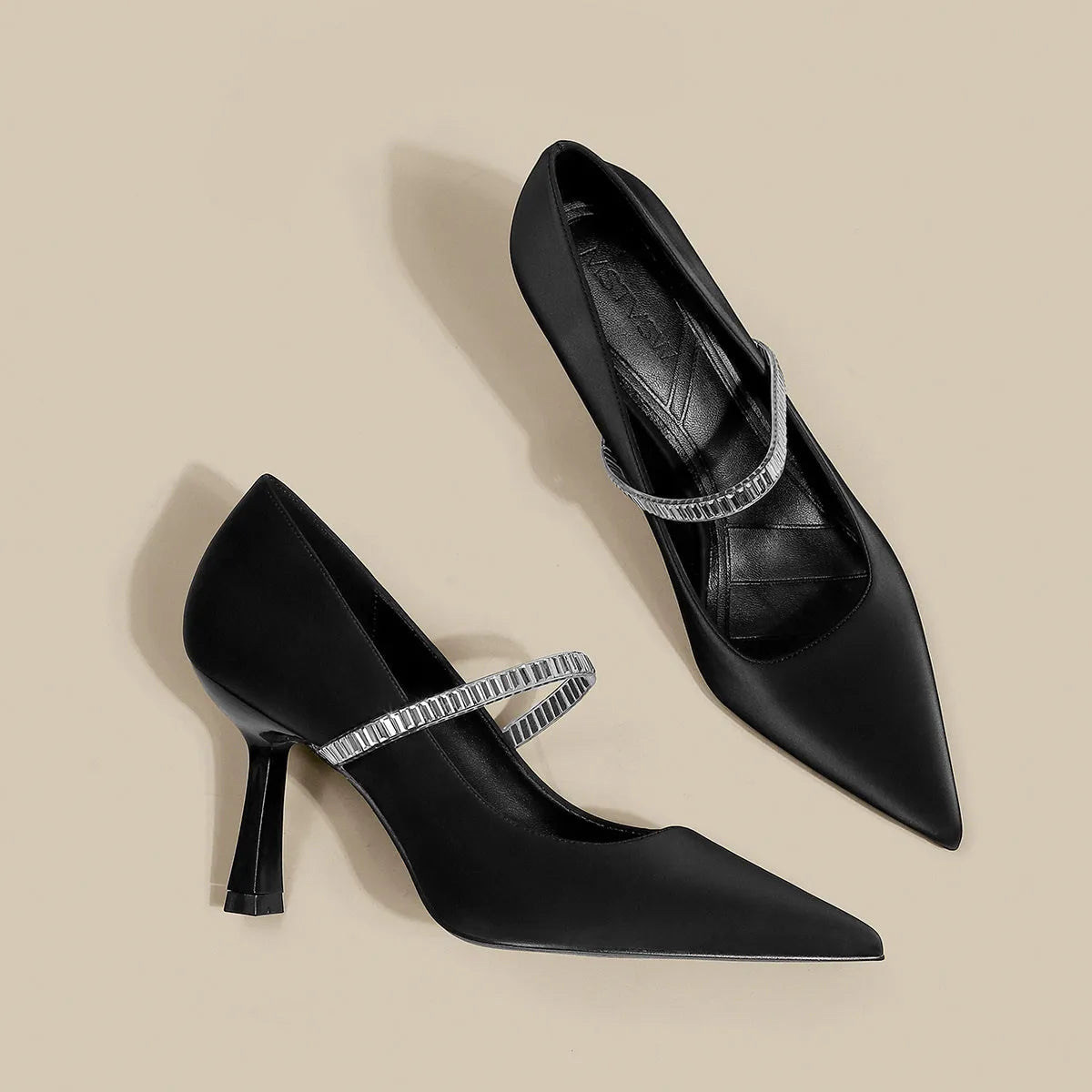 Black women's stiletto sandals with pointed toe and buckle strap closure