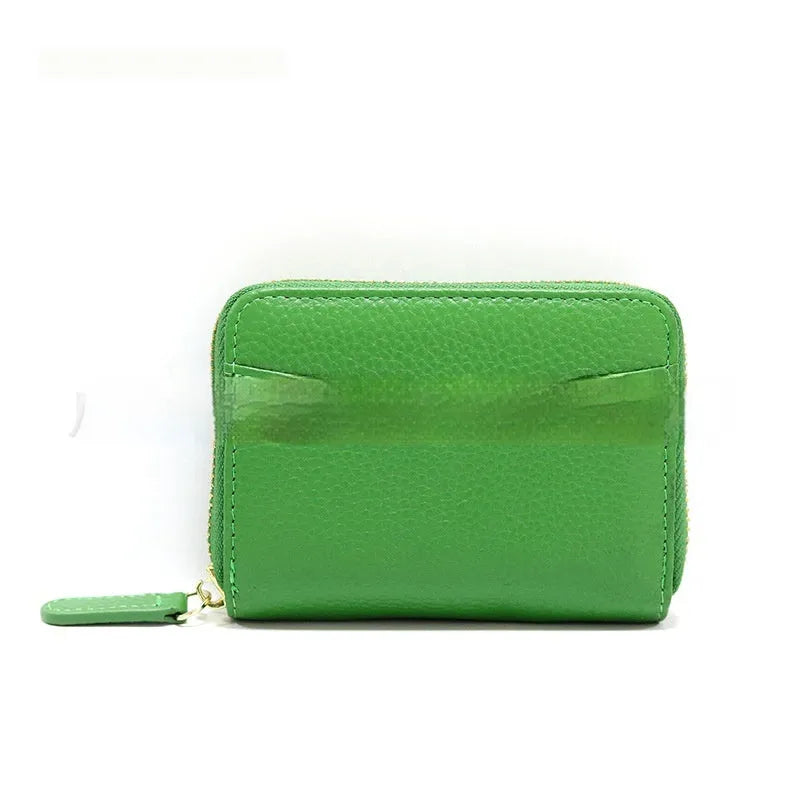 Genuine leather zipper coin purse in a solid colour showing sewing line detail.