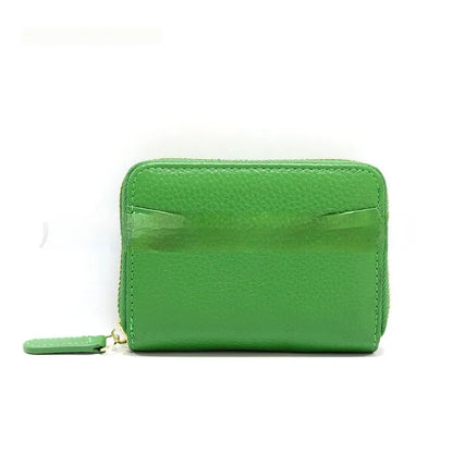 Genuine leather zipper coin purse in a solid colour showing sewing line detail.