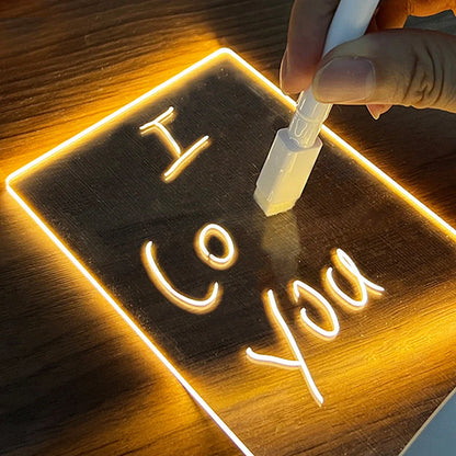 Customizable LED message board with warm lighting, acrylic design, and included erasable pen for personalized notes and artwork