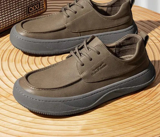 Retro brown leather lace-up casual shoes for men with visible stitching and a rubber sole.