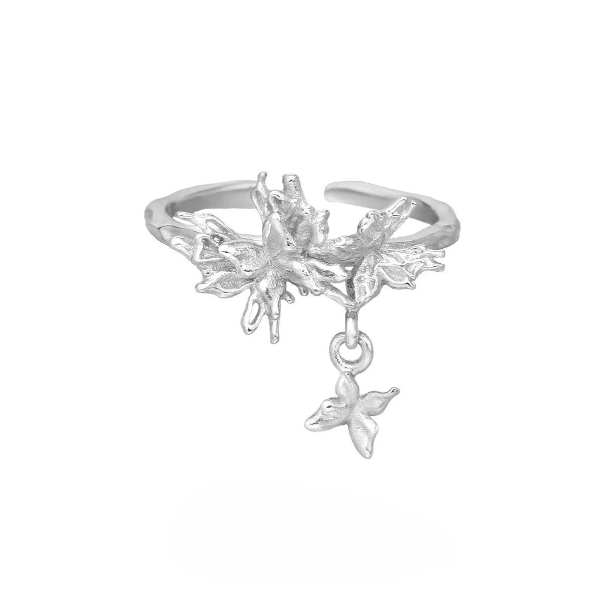 Adjustable open silver ring with a wild butterfly design in a choice of metallic finishes.