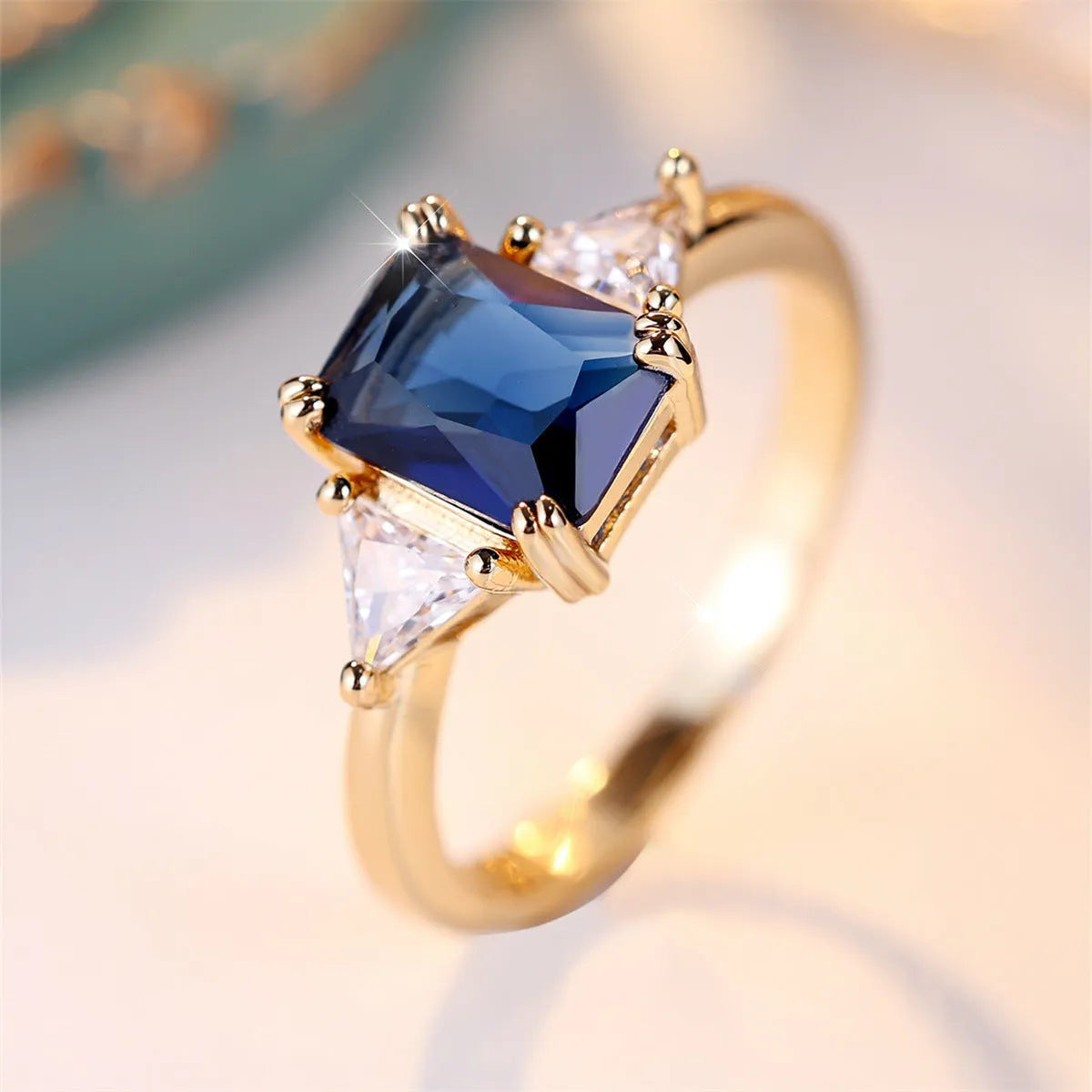 Rectangular women's fashion ring in gold sapphire blue copper with geometric design