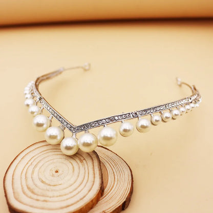 Silver tone bridal crown with pearl detail, about 13 cm diameter and 3 cm height, simple wedding hair accessory