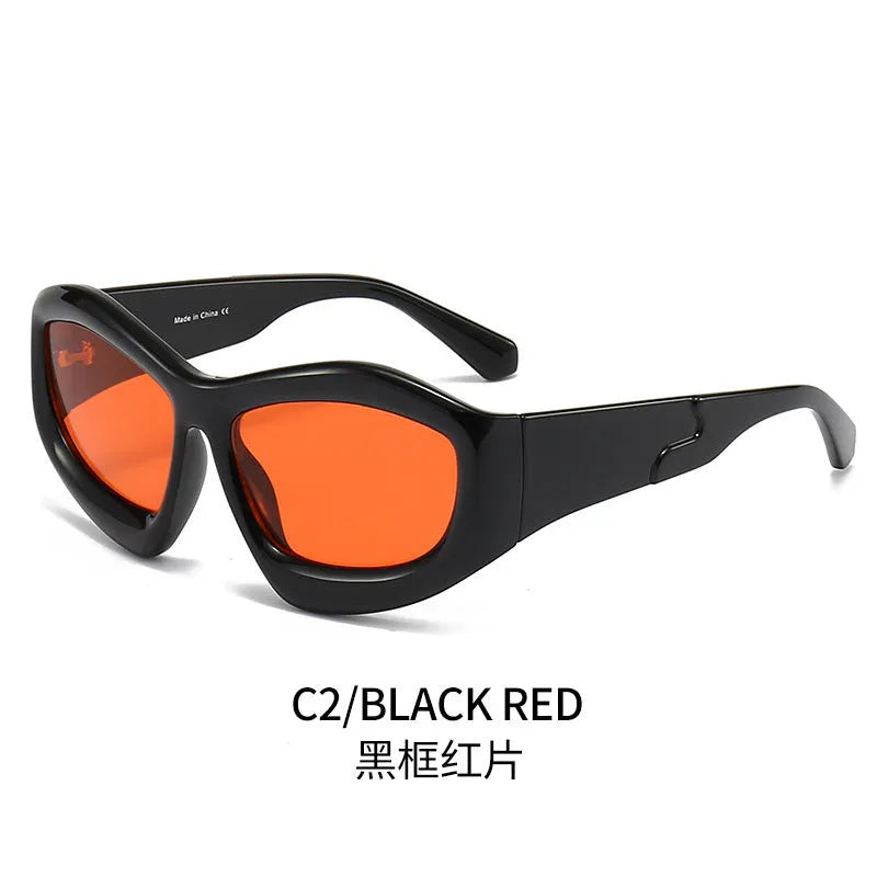 Outdoor unisex sunglasses with concave bubble lenses in black frame on a table.