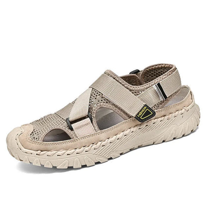 Men's gray casual sandals with mesh panels, leather upper, elastic strap, and rubber sole.