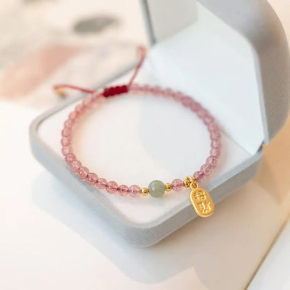 Red rope hand-woven bracelet with strawberry quartz crystals in national tide style