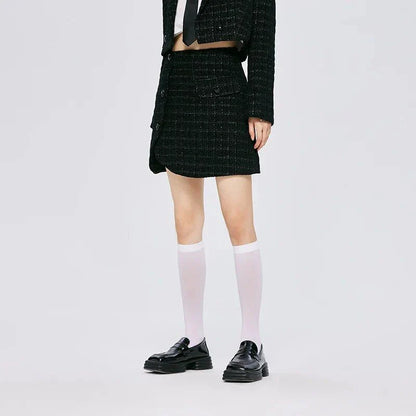 Chic asymmetric plaid a-line skirt in pink, featuring a unique design with button details and a flattering silhouette