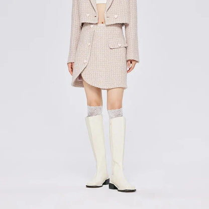 Chic asymmetric plaid a-line skirt in pink, featuring a unique design with button details and a flattering silhouette