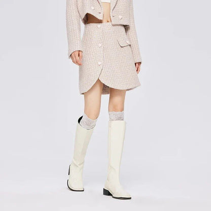 Chic asymmetric plaid a-line skirt in pink, featuring a unique design with button details and a flattering silhouette