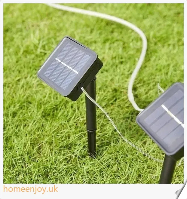 40ft solar-powered garden pathway light strips in use, illuminating a winding garden path with a warm, enchanting glow