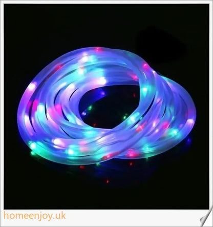 40ft solar-powered garden pathway light strips in use, illuminating a winding garden path with a warm, enchanting glow