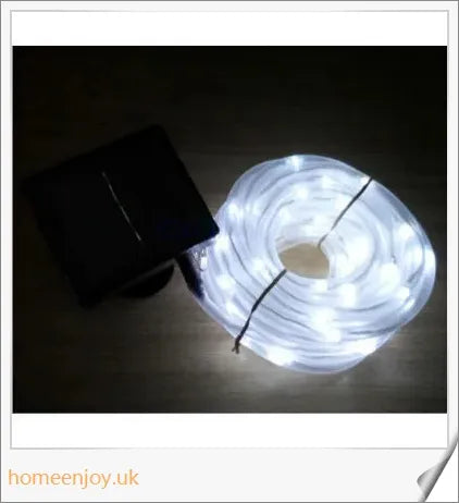 40ft solar-powered garden pathway light strips in use, illuminating a winding garden path with a warm, enchanting glow