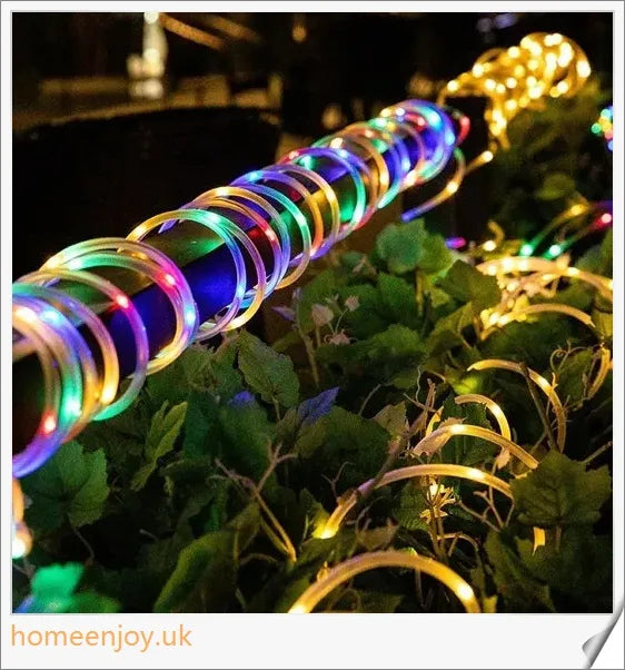 40ft solar-powered garden pathway light strips in use, illuminating a winding garden path with a warm, enchanting glow