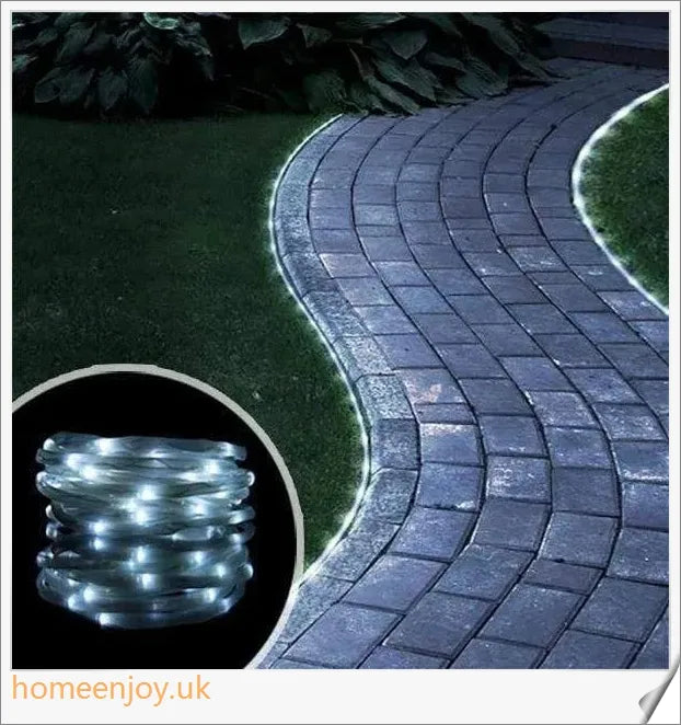 40ft solar-powered garden pathway light strips in use, illuminating a winding garden path with a warm, enchanting glow