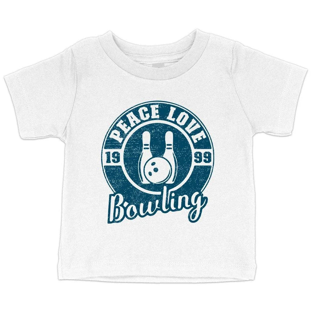 A soft, white baby t-shirt with a cute bowling-themed design, perfect for infants and toddlers.