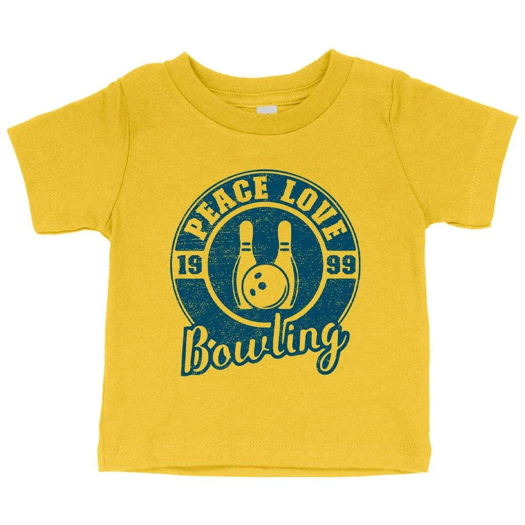 A soft, white baby t-shirt with a cute bowling-themed design, perfect for infants and toddlers.