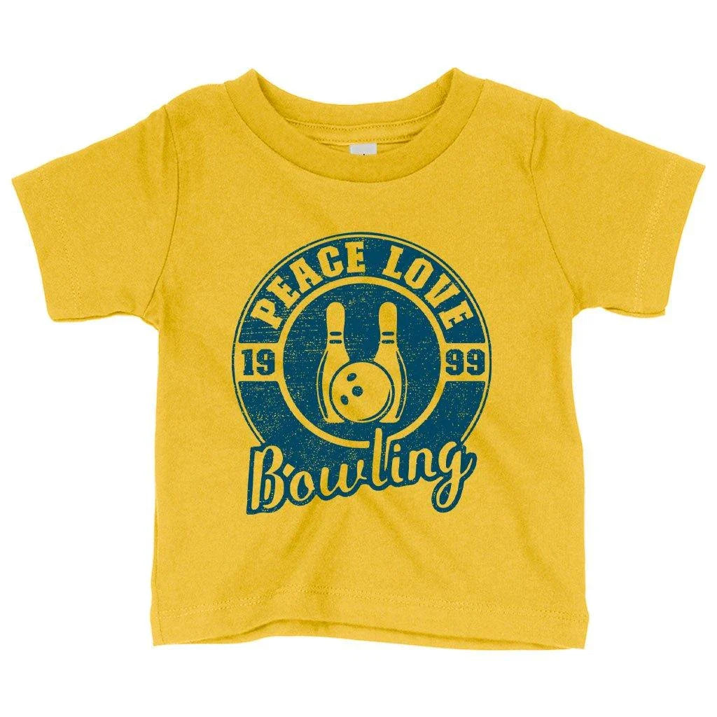 A soft, white baby t-shirt with a cute bowling-themed design, perfect for infants and toddlers.