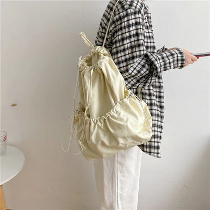 Creative drawstring bucket bag in white, black, brown, and zebra print patterns - a stylish and versatile women's tote bag made of high-quality polyester material