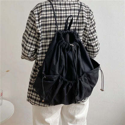 Creative drawstring bucket bag in white, black, brown, and zebra print patterns - a stylish and versatile women's tote bag made of high-quality polyester material