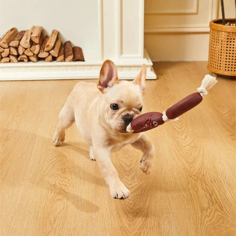 Durable cotton rope and vinyl sausage chew toy for dogs, designed to entertain and promote dental hygiene.