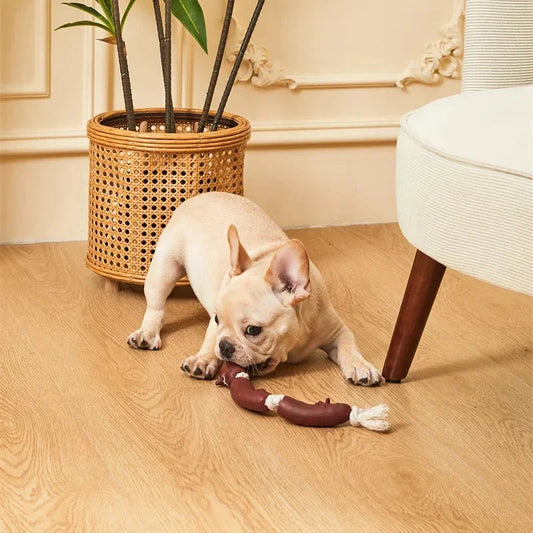 Durable cotton rope and vinyl sausage chew toy for dogs, designed to entertain and promote dental hygiene.