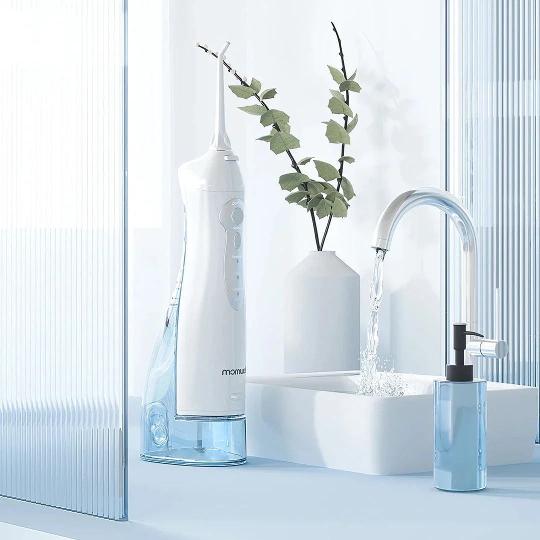 A stylish, rechargeable water flosser with four interchangeable nozzles for a personalised and thorough dental cleaning experience.