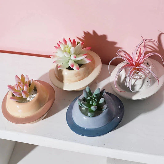 Mini Planet Shape Ceramic Succulent Flower Pot with a smooth, planet-inspired design in blue colour
