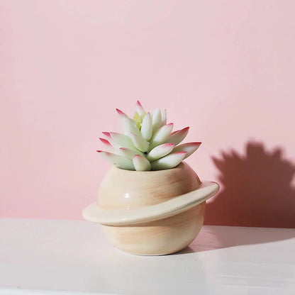Mini Planet Shape Ceramic Succulent Flower Pot with a smooth, planet-inspired design in blue colour