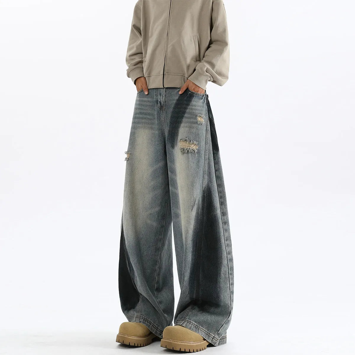 Men's blue ripped jeans with splash-ink distressing and loose fit