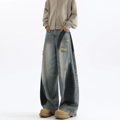Men's blue ripped jeans with splash-ink distressing and loose fit